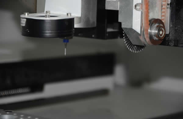 The machine has two z-axes, one is a round cutter installed to cut v-cut slots, the other is a Milling cutter installed to cut stamp holes. 